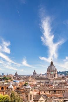 Rome, Italy. Urban landscape, blue sky with clouds, church exterior architecture.