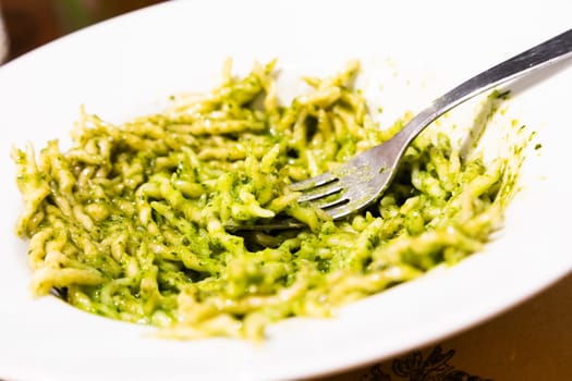 Traditional Italian food - trofie al pesto, typical regional pasta from Liguria region, with basil sauce