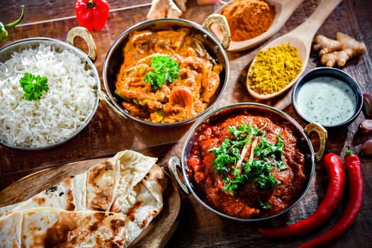 Hot madras paneer and vegetable masala with basmati rice served in original indian karahi pots.