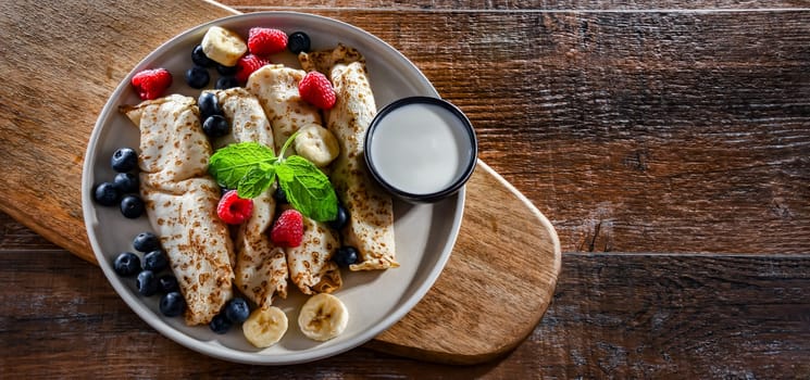 A plate of home-made Polish pancakes filled with sweet cottage cheese