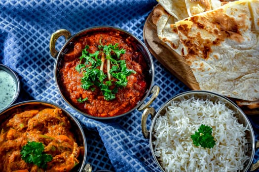 Hot madras paneer and vegetable masala with basmati rice served in original indian karahi pots.