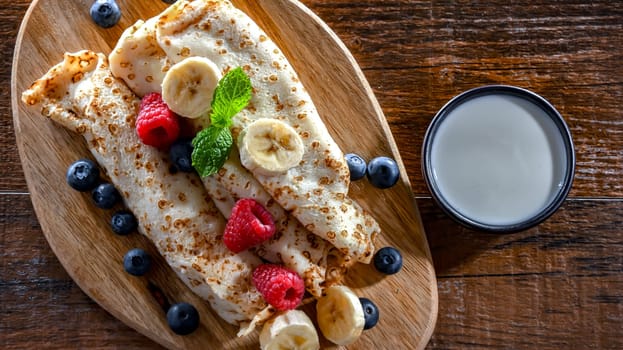 A plate of home-made Polish pancakes filled with sweet cottage cheese