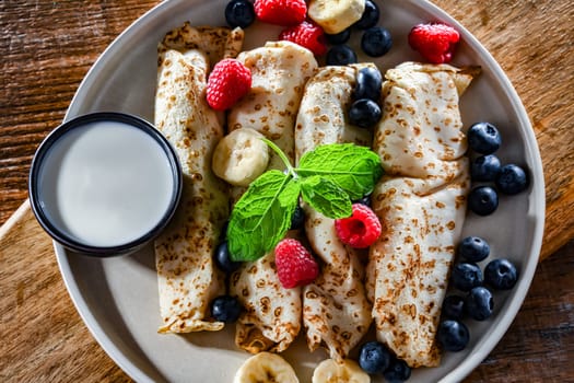 A plate of home-made Polish pancakes filled with sweet cottage cheese