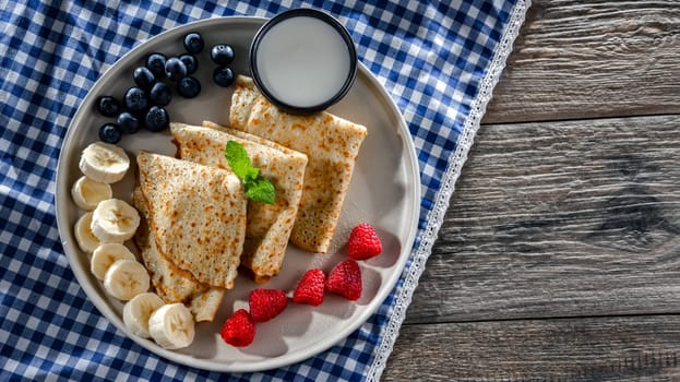 A plate of home-made Polish pancakes filled with sweet cottage cheese