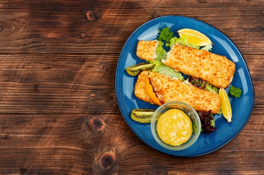 Pollock fillet roasted in bread crumbs and with kiwi. Fish. Copy space.