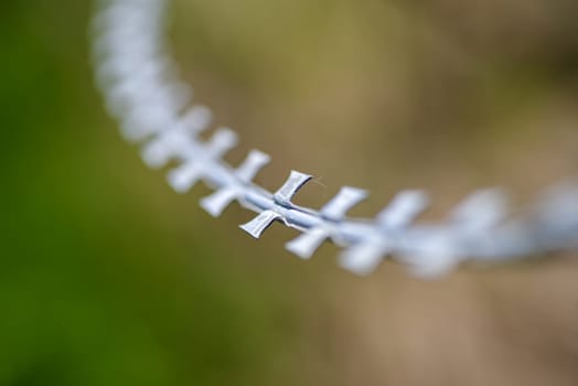 closeup of very sharp razor blade barbed wire