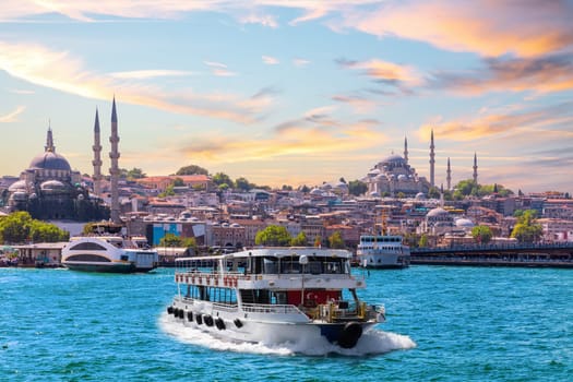 Famous Suleymaniye and Rustem Pasha Mosques and the cruise boat on the Bosphorus, popular place of Istanbul, Turkey.