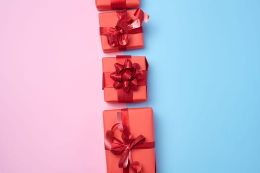 Boxes packed in red paper and tied with ribbon, gifts