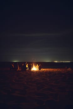 Inviting campfire on the beach during the summer, bring back fond memories. Fun and good times at the lake or sea.