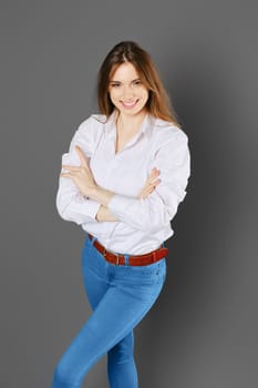 Top view of happy smiling woman with arms crossed on chest
