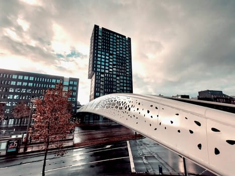 Antwerp, Belgium, November 5th 2023: View on Noorderplaats in Antwerp with pedestrian bridge Parkbrug