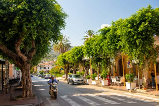 Gioiosa Marea, Sicily, Italy - 27. September 2023. Centre of the town of Gioiosa Marea with a street cafe and an ice cream bar in the province of Messina.