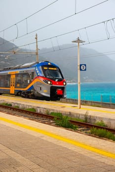 Gioiosa Marea, Sicily, Italy - 25 September 2023. A Trenitalia train arriving at Gioiosa Marea station for onward journey to Messina Central.