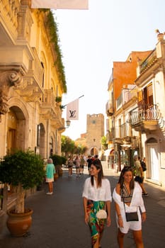 Taormina, Sicily, Italy - 28 September 2023. Tourists in the famous main street Corso umberto in Taormina. City views, facades, architecture and the most popular streets.