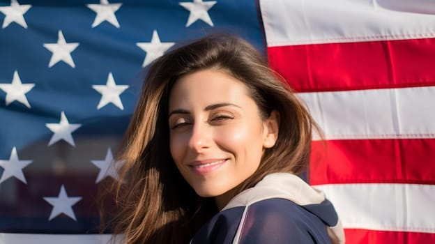 Young brunette woman with United States USA flag behind her.