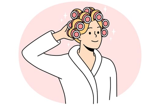Smiling young woman in bathrobe and curlers on head getting ready. Happy female do beauty procedures at home. Vector illustration.