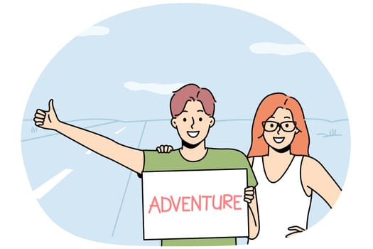 Smiling couple hitchhiking on road
