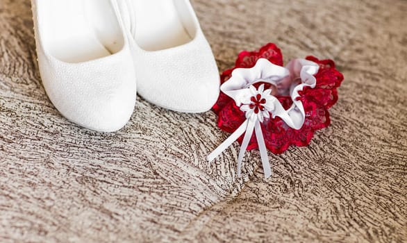 Beautiful wedding white bridal garter. Wedding day moments