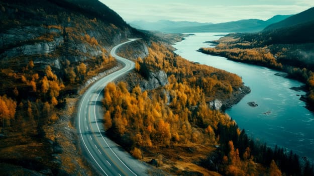Aerial panoramic view of amazing curved road through the mountains during an autumn season . AI generated