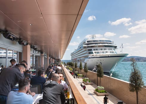 Istanbul, Turkey - May 13, 2023: MV Viking Sky, Large cruise ship docked at terminal of Galataport, a mixed use development located along shore of Bosphorus strait, in Karakoy neighbourhood
