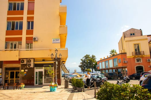 MILAZZO, SIZILY, Italy - 03 October 2023. The street Piano Baele with the English Zenrum and in the background the ''Fountain of the Amphorae'' or fountain of Stephen Descartes in Milazzo.