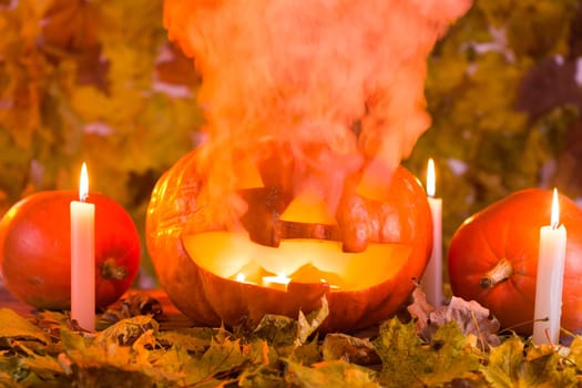 Jack-o-Lantern halloween pumpkin with mist pouring from it's mouth.