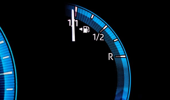 Car fuel gauge indicating full tank. Digital car dashboard indicators