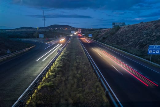 Traffic at dusk crossing the Autovia A-5, km 341. Slow motion shot