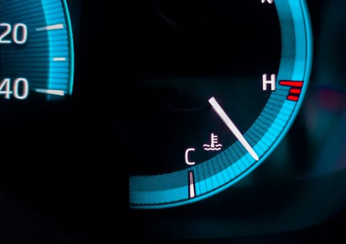 Car temperature gauge closeup. Digital car dashboard indicators
