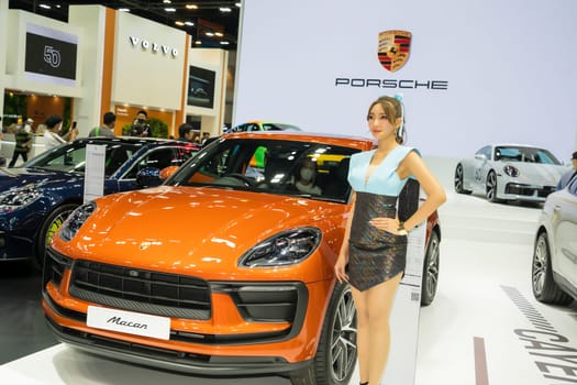 Nonthaburi, Thailand - APR 2, 2023 Unidentified model poses with a car at The 44th Bangkok international motor show 2023 at IMPACT Arena, Muang Thong Thani, Nonthaburi, Thailand.