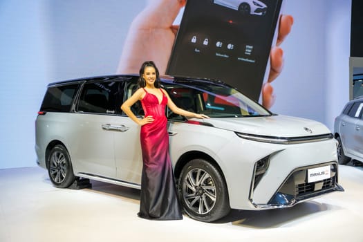 Nonthaburi, Thailand - APR 2, 2023 Unidentified model poses with a car at The 44th Bangkok international motor show 2023 at IMPACT Arena, Muang Thong Thani, Nonthaburi, Thailand.