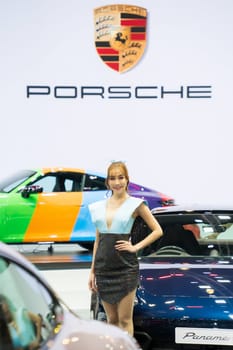 Nonthaburi, Thailand - APR 2, 2023 Unidentified model poses with a car at The 44th Bangkok international motor show 2023 at IMPACT Arena, Muang Thong Thani, Nonthaburi, Thailand.