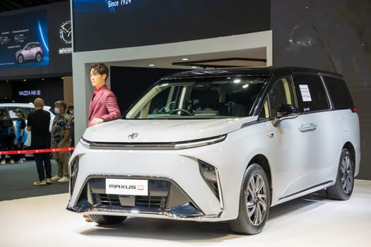 Nonthaburi, Thailand - APR 2, 2023 Unidentified model poses with a car at The 44th Bangkok international motor show 2023 at IMPACT Arena, Muang Thong Thani, Nonthaburi, Thailand.