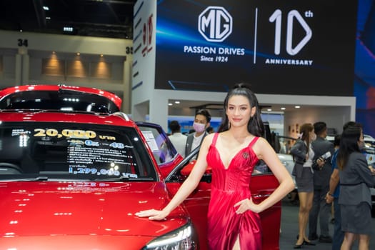 Nonthaburi, Thailand - APR 2, 2023 Unidentified model poses with a car at The 44th Bangkok international motor show 2023 at IMPACT Arena, Muang Thong Thani, Nonthaburi, Thailand.