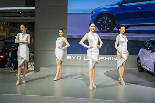Nonthaburi, Thailand - APR 2, 2023 Unidentified model poses with a car at The 44th Bangkok international motor show 2023 at IMPACT Arena, Muang Thong Thani, Nonthaburi, Thailand.