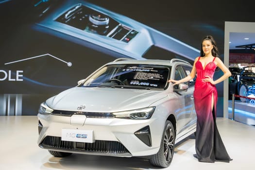 Nonthaburi, Thailand - APR 2, 2023 Unidentified model poses with a car at The 44th Bangkok international motor show 2023 at IMPACT Arena, Muang Thong Thani, Nonthaburi, Thailand.