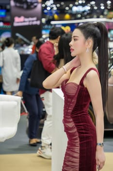 Nonthaburi, Thailand - APR 2, 2023 Unidentified model poses with a car at The 44th Bangkok international motor show 2023 at IMPACT Arena, Muang Thong Thani, Nonthaburi, Thailand.
