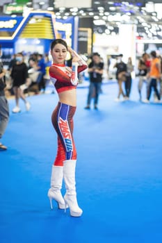 Nonthaburi, Thailand - MAR 26, 2023 Unidentified model poses with a car at The 44th Bangkok international motor show 2023 at IMPACT Arena, Muang Thong Thani, Nonthaburi, Thailand.