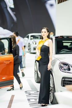 Nonthaburi, Thailand - MAR 26, 2023 Unidentified model poses with a car at The 44th Bangkok international motor show 2023 at IMPACT Arena, Muang Thong Thani, Nonthaburi, Thailand.