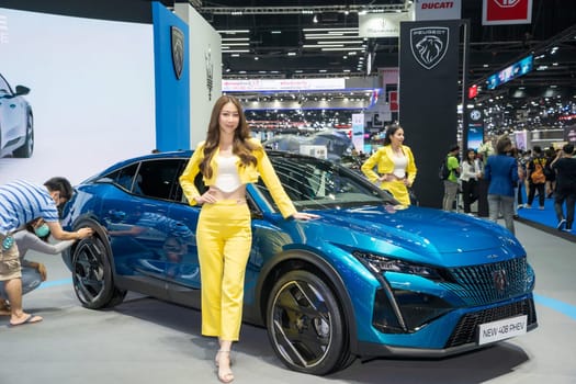 Nonthaburi, Thailand - APR 2, 2023 Unidentified model poses with a car at The 44th Bangkok international motor show 2023 at IMPACT Arena, Muang Thong Thani, Nonthaburi, Thailand.