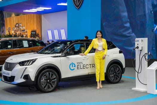 Nonthaburi, Thailand - APR 2, 2023 Unidentified model poses with a car at The 44th Bangkok international motor show 2023 at IMPACT Arena, Muang Thong Thani, Nonthaburi, Thailand.