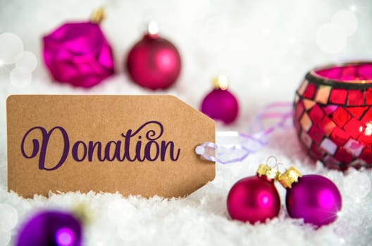 Label With Text Donation, White Snow Background With Purple Christmas Balls, Christmas And Winter Decor