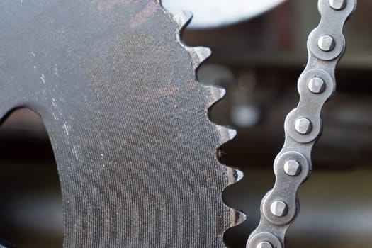 a close up of motocycle chain and ring gear