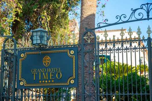 Taormina, Sicily, Italy - 28 September 2023. At the end of the street Via Teatro Greco the entrance to the Grand Hotel Timeo next to the ancient theatre of Taormina.