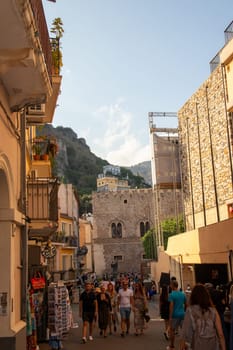 Sicily, Taormina, Italy - 28 September 2023. Tourists in the main street Corso umberto in Taormina. City views, facades, architecture and the most popular streets.