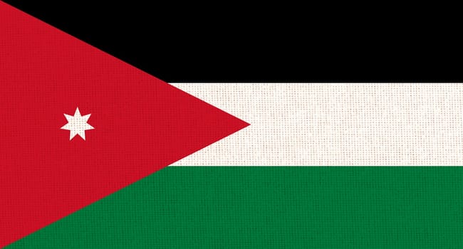National Jordan flag on fabric surface. national flag on textured background. Fabric Texture. Hashemite Kingdom of Jordan. Asian country. State symbol of Jordan