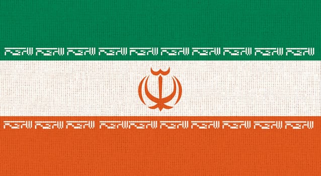 flag of Iran. National Iranian flag on fabric surface. Iranian national flag on textured background. Fabric Texture. Islamic Republic of Iran. Asian country. State symbol of Iran
