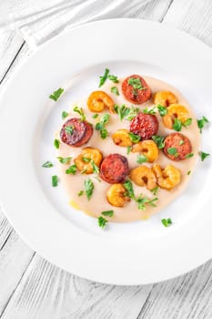 Warm white bean dip with chorizo and prawns