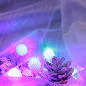 Fairy tale Christmas background with toys, cones and garlands.