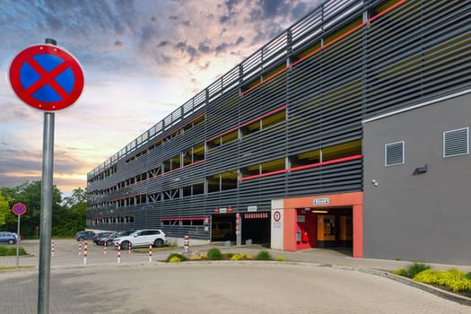 Facade of a modern public Parking Area with no stopping sign